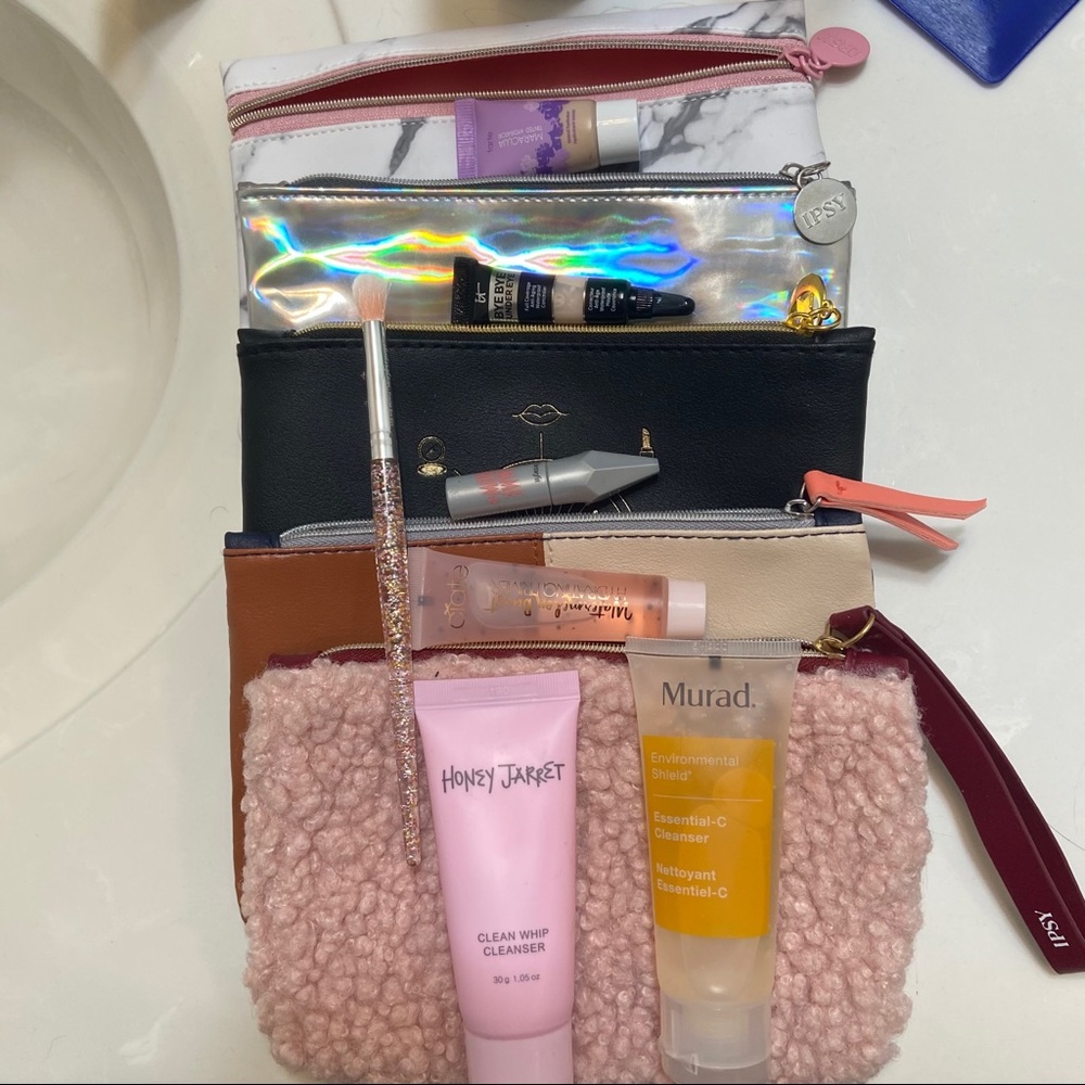 Assorted makeup and skincare products, Ipsy bags